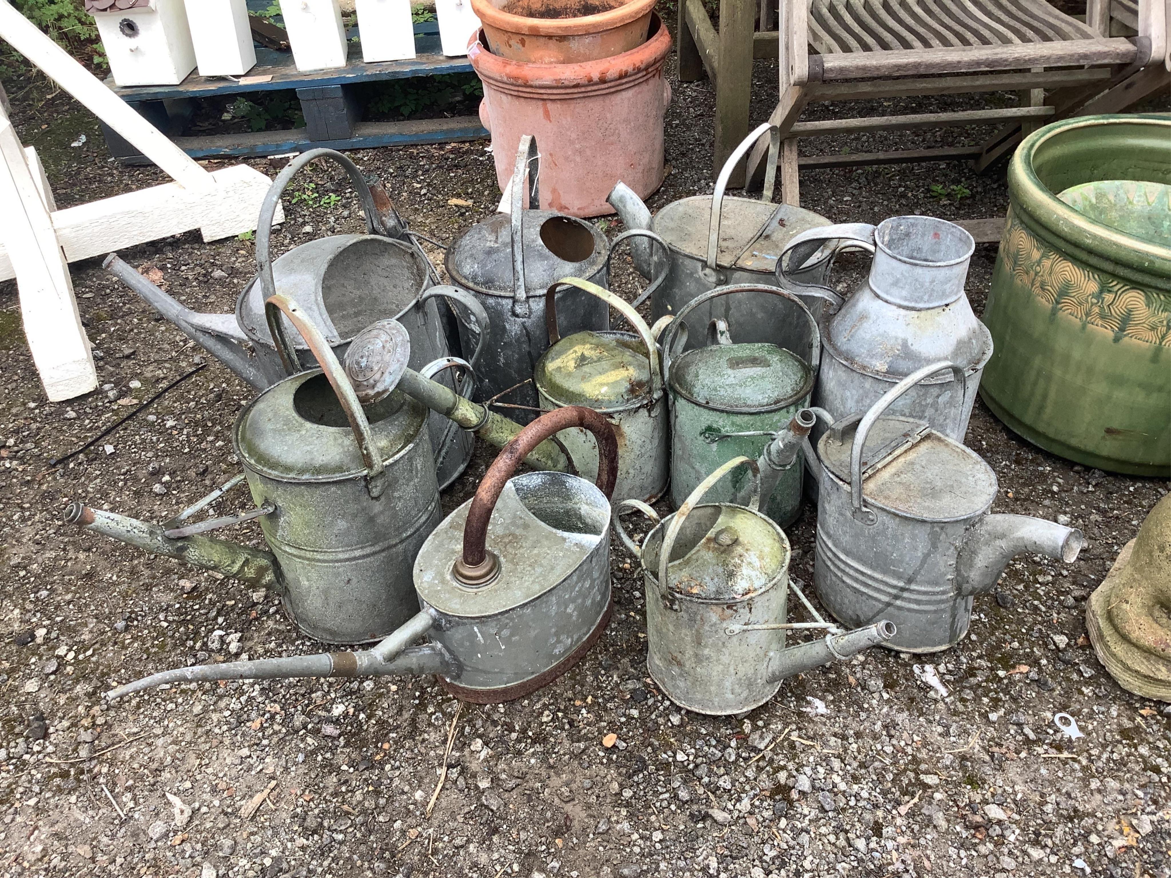 Ten assorted vintage galvanised watering cans and containers, largest height 44cm. Condition - fair